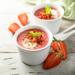 Homemade strawberry soup with chocolate and cream