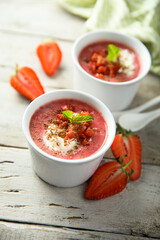 Homemade strawberry soup with chocolate and cream