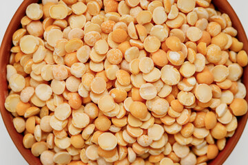 Pea groats in bowls and bags isolated on a white background. High quality photo