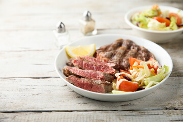 Grilled beef steak with vegetable salad