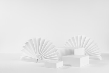 Set of three white rectangle podiums mockup for presentation, showing, displaying cosmetic product or goods with ribbed paper fans, blinds in elegant minimalistic modern style, side view, corner, 3d.