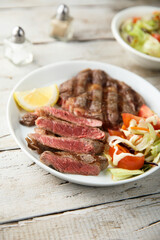 Grilled beef steak with vegetable salad