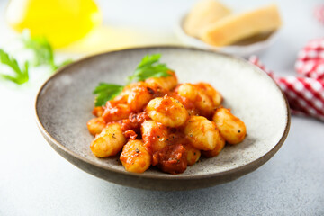Homemade gnocchi with tomato sauce and cheese