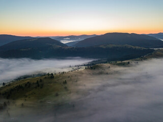 Morning fog in the Ukrainian Carpathians. Aerial drone view.