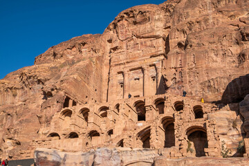 Ruins of the ancient city of Petra in Jordan in a sunny day. Petra is an important archaeological site built with stone.
