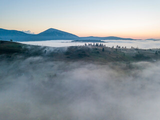 Morning fog in the Ukrainian Carpathians. Aerial drone view.
