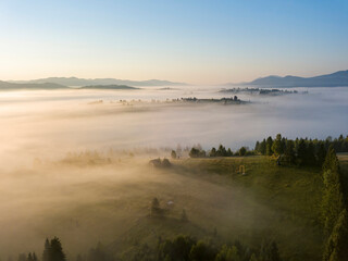 Morning fog in the Ukrainian Carpathians. Aerial drone view.