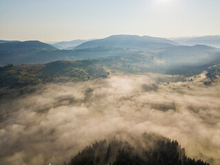 Morning fog in the Ukrainian Carpathians. Aerial drone view.
