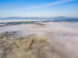 Morning fog in the Ukrainian Carpathians. Aerial drone view.