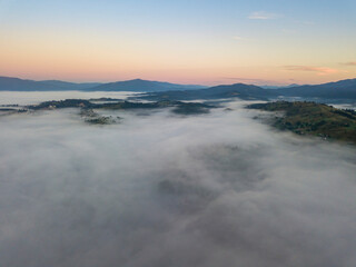 Morning fog in the Ukrainian Carpathians. Aerial drone view.
