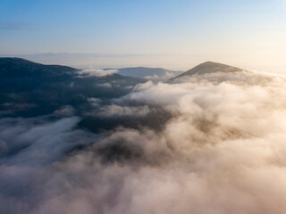 Morning fog in the Ukrainian Carpathians. Aerial drone view.