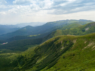 Obraz premium High mountains of the Ukrainian Carpathians in cloudy weather. Aerial drone view.