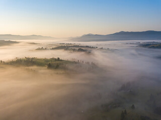 Morning fog in the Ukrainian Carpathians. Aerial drone view.