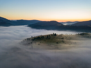 Morning fog in the Ukrainian Carpathians. Aerial drone view.