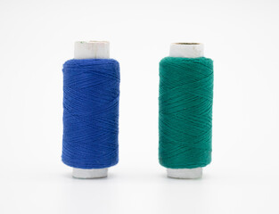 Dark Cyan and blue yarn on spool, yarn on tube, cotton, wool, linen thread, isolate on white background