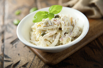 Homemade squid salad with capers