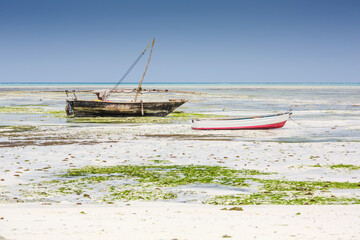 Authentic african boata in beautiful turquoise ocean beach, Zanzibar island