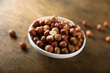Organic hazelnut in a white bowl