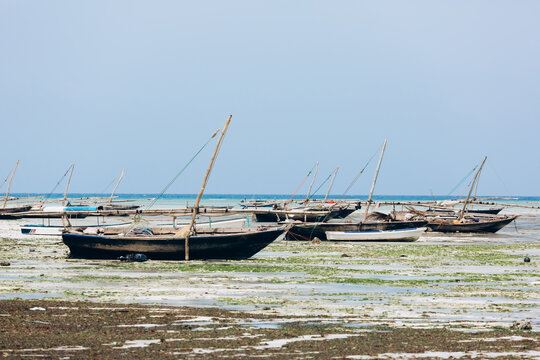Authentic african boata in beautiful turquoise ocean beach, Zanzibar island