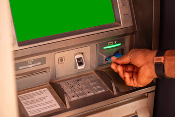 african person using an atm