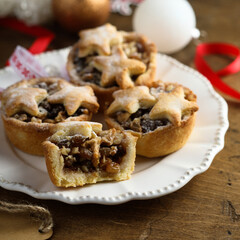 Traditional festive mince pies on a plate	
