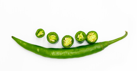 green chili with slices over on white background