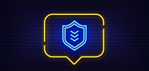Neon light speech bubble. Shield line icon. Protection symbol. Business security sign. Neon light background. Shield glow line. Brick wall banner. Vector