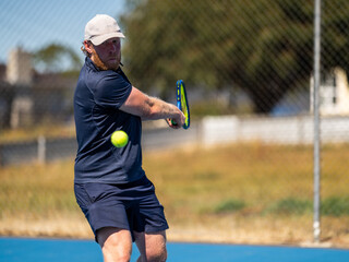 Tennis playing hitting tennis balls in Melbourne and tasmania, in Australia