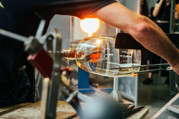Creating traditional glass Art with Hot Torch and glassblowing pipe