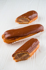 Eclairs with chocolate topping close up