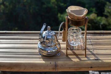 Set of drip coffee on bamboo table