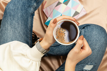 girl sitting coffee cup in hand