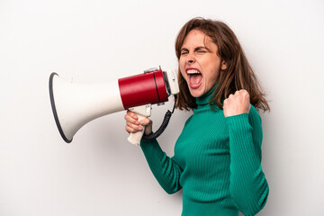 Young caucasian woman holding a megaphone isolated on white background