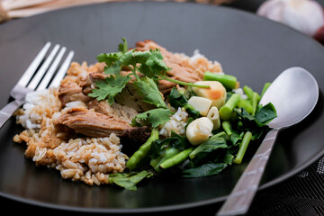 Stewed pork leg on rice, Thai food and street food that Thai people like to eat. or what we call 