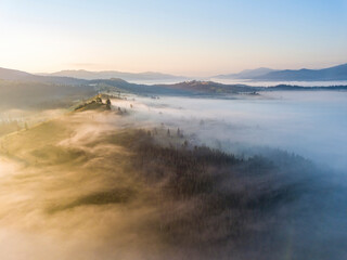Morning fog in the Ukrainian Carpathians. Aerial drone view.