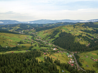 Green mountains of Ukrainian Carpathians in summer. Aerial drone view.