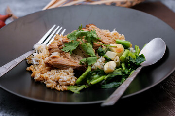 Stewed pork leg on rice, Thai food and street food that Thai people like to eat. or what we call 