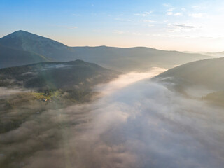 Morning fog in the Ukrainian Carpathians. Aerial drone view.