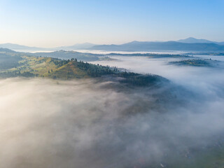 Morning fog in the Ukrainian Carpathians. Aerial drone view.