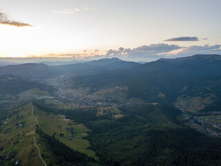 Sunset over the mountains in the Ukrainian Carpathians. Aerial drone view.