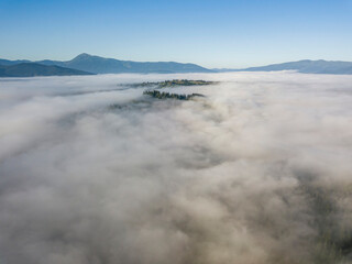 Morning fog in the Ukrainian Carpathians. Aerial drone view.