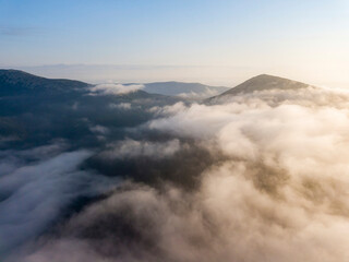 Obraz premium Morning fog in the Ukrainian Carpathians. Aerial drone view.