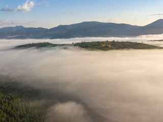 Morning fog in the Ukrainian Carpathians. Aerial drone view.
