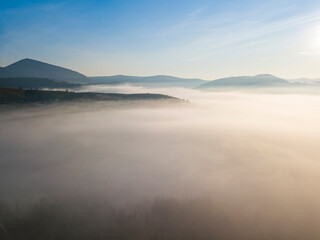 Fototapeta na wymiar Morning fog in the Ukrainian Carpathians. Aerial drone view.