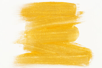 golden paint smeared on a white background