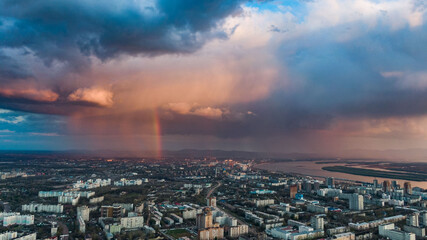 Fototapeta premium Khabarovsk city top view sunset beautiful clouds in the rain