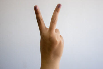 hand showing peace sign