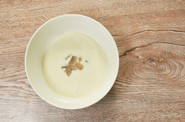 creamy soup topping slice champignon mushrooms in bowl