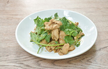fried chicken with garlic and pepper topping fresh parsley on plate