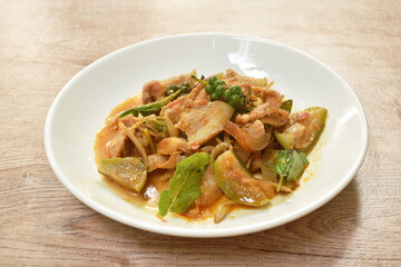 stir fried spicy wild boar and finger root with red curry on plate